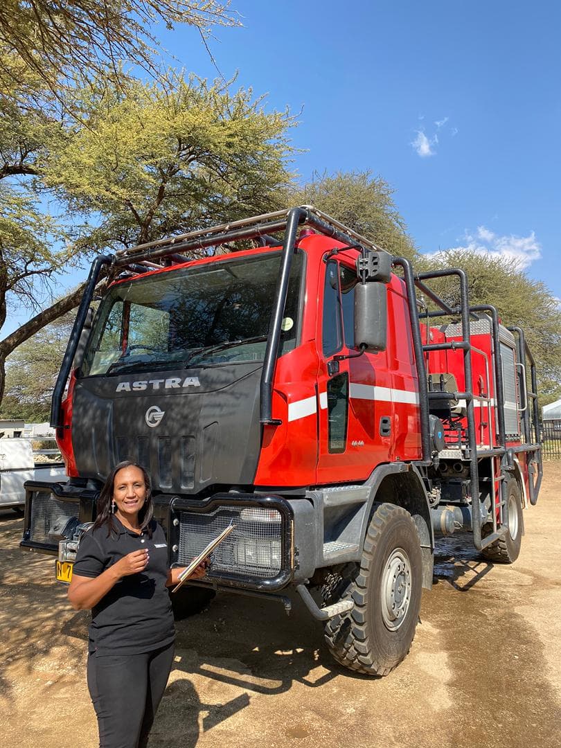 Khoisan technician servicing a fire vehicle pump system